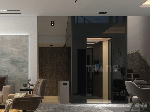 Modern home lift inside a residential home with glass cabin